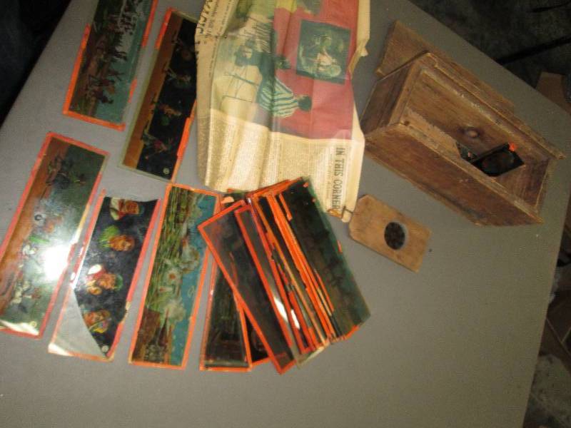 lot 235 image: Antique box of lenses with pictures...