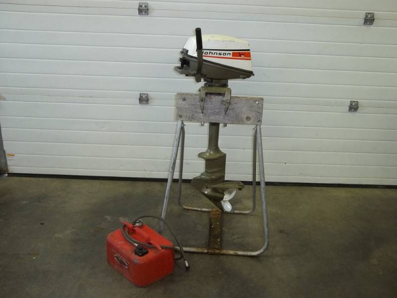 lot 54 image: 1973 4 hp Johnson outboard motor with tank, Tested and runs, Stand not included