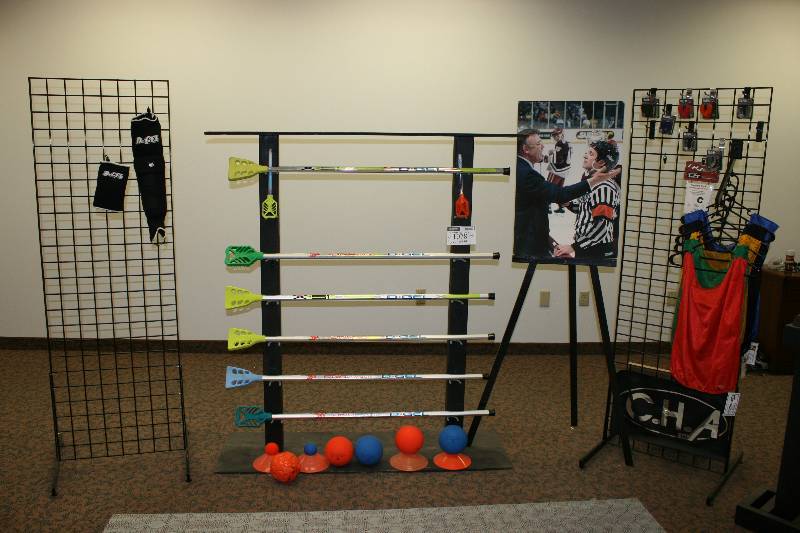lot 1078 image: Contents of Metal Displays Including Metal Lacrosse Stick Display Metal Wire Grate Displays, 73.5 x 25 Lacrosse sticks Practice Balls And More.