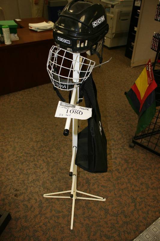 lot 1080 image: Contents of Metal Display Rack wDisplay Arms, 53 Height Includes Hockey Helmet & Tote.
