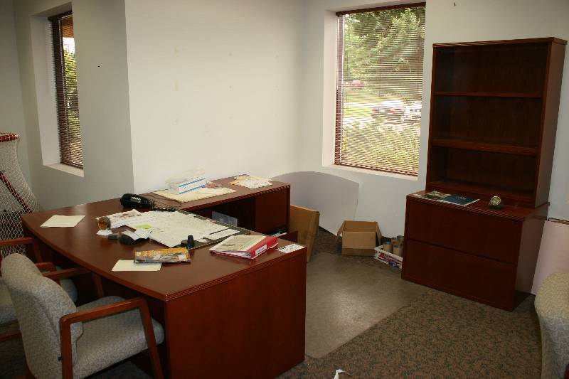 lot 1082 image: Lot of (4) Including Wood Style Cabinet wShelves & Drawers, 24 x 37 x 76.5 Wood style Office Desk w2 Drawers, L-Shaped, 87 x 72 x 24 x 37 Office Chairs wArm Rests & Cloth Upholstery (2).