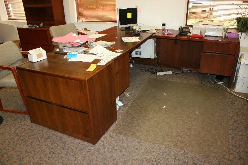 lot 1083 image: Lot of (4) Including Wood-Style Office Desk wDrawers, L-Shaped, 87 x 71 x 20 x 35 Wood Style Cabinets wTwo Drawers, 20 x 37 x 29.5 Leather-Style Office Chair wArm Rests & Wheels Does Not Include Contents.