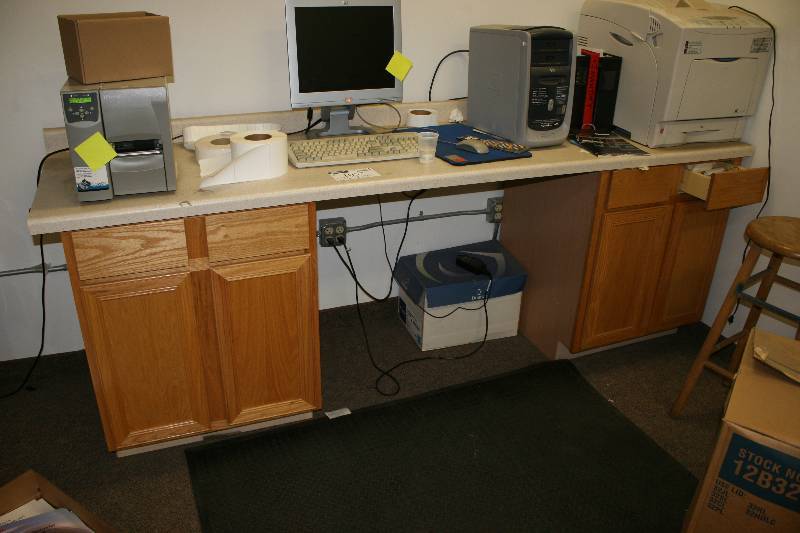 lot 1057 image: Cabinet Lot Including Wooden Cabinets wCountertop (2) 25.5 x 96.5 x 38.5 25.5 x72 x 38.5 Does Not Include Contents.
