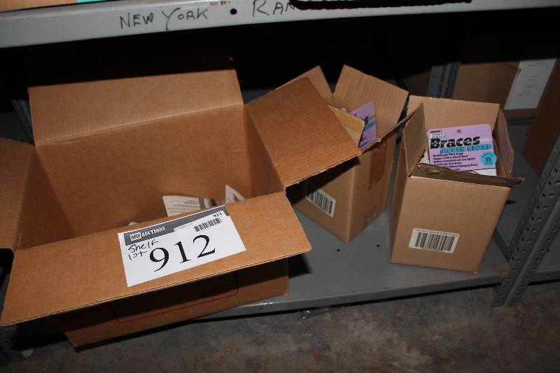 lot 912 image: Shelf Lot Including Braces Mouth Guards Engages Teeth To Absorb Shock.