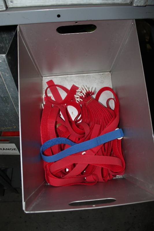 lot 628 image: Shelf Lot Including Hockey Sport Straps,PurpleBlackRed Metal Containers wHandles (3).