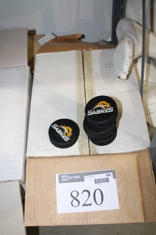 lot 820 image: Box Lot of Hockey Pucks wBuffalo Sabres Logo.