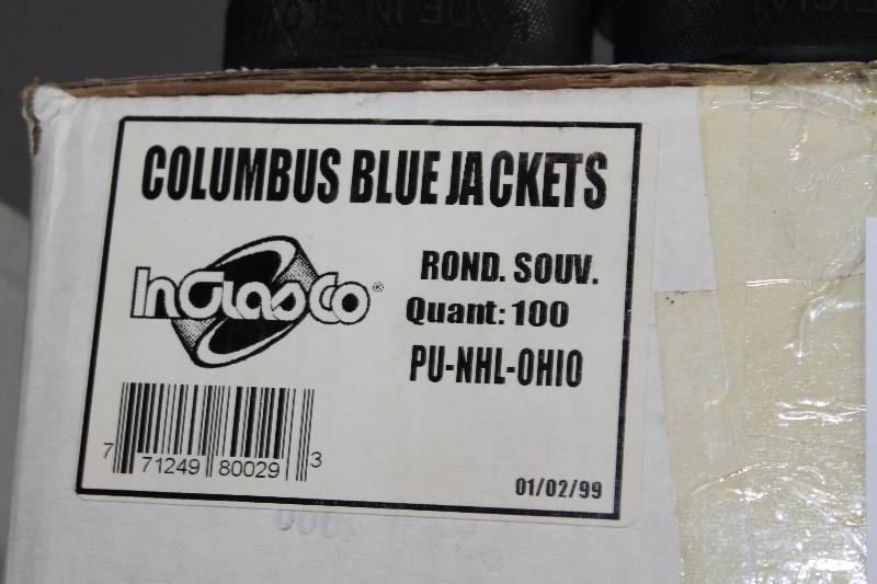 lot 823 image: Box Lot of Hockey Pucks wColumbus Blue Jackets Logo.