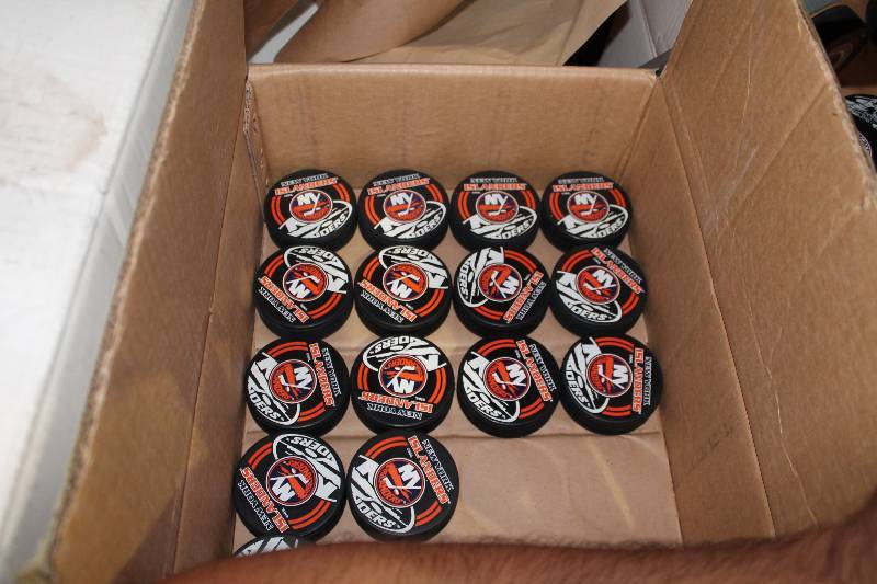 lot 826 image: Box Lot of Hockey Pucks wNew York Islanders Logo.