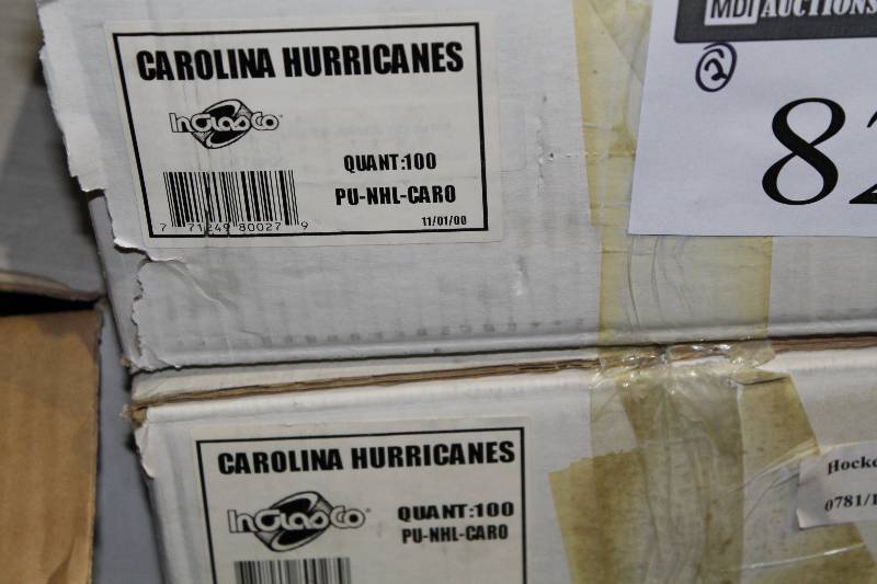 lot 827 image: Box Lot of (2) Hockey Pucks wCarolina Hurricanes Logo.