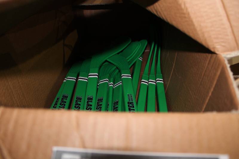 lot 833 image: Box Lot of Mini Hockey Sticks Blaster Type Green.