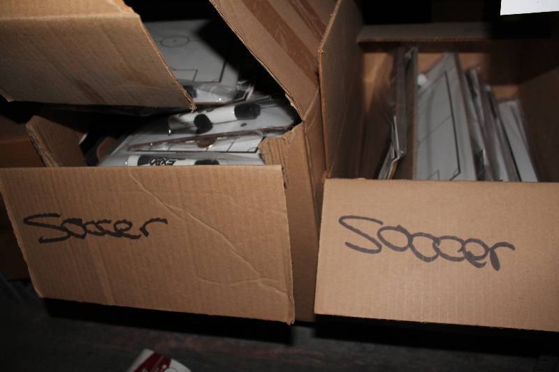 lot 869 image: Shelf Lot Including Soccer Play Maker Dry Erase Board C.H.A. Brand.