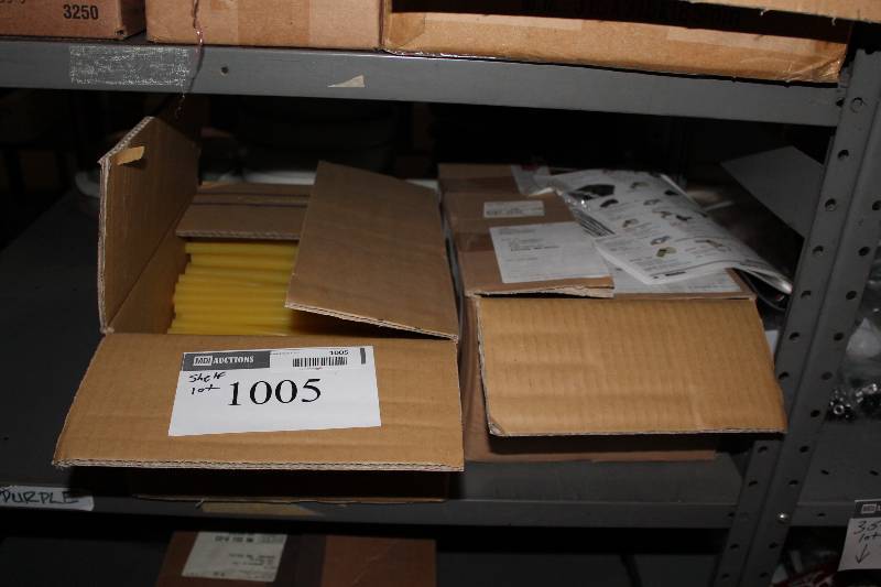 lot 1005 image: Shelf Lot Including Yellow Wax Glue Sticks.