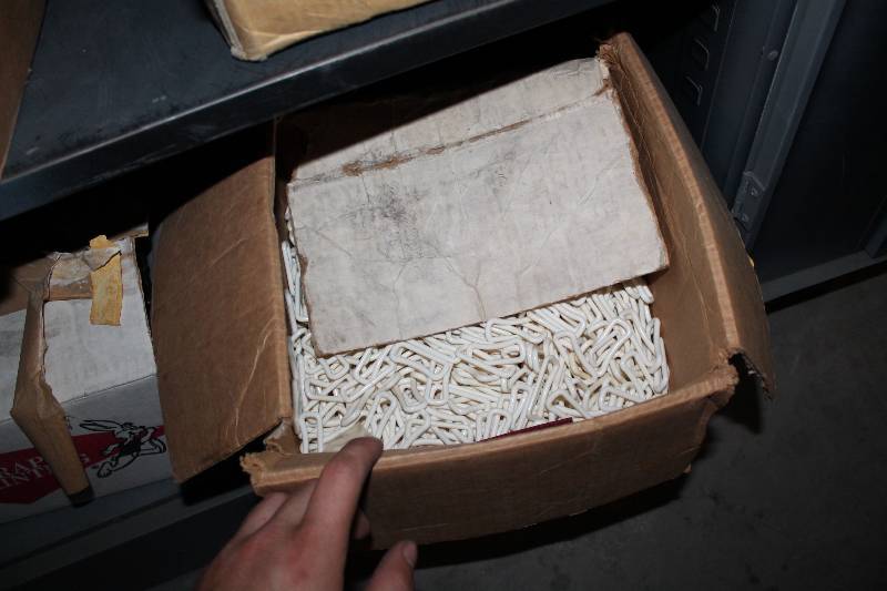 lot 939 image: Contents of Cabinet Including Plastic Clips Plastic Plates Masking Tape Rolls And More.