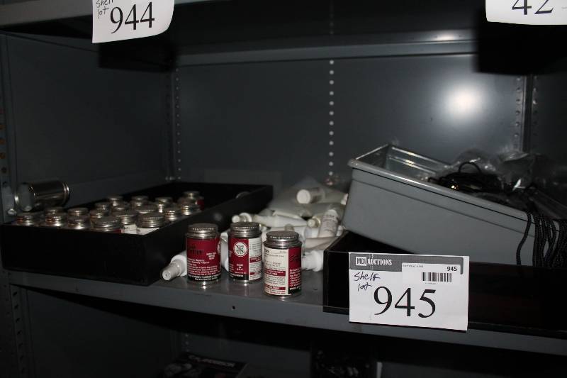 lot 945 image: Shelf Lot Including Plastic Bins (3) Scuff Tuff Protector & Repair Hockey scents White Plastic Bottles wSpray Lids & Caps.