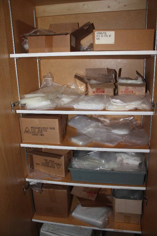 lot 951 image: Contents of Cabinet Including 9 x 12 Clear Plastic Bags Reclosable Poly Bags Bags For Skate Guards And More.