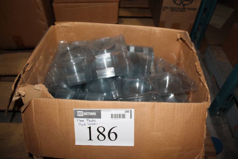 lot 186 image: Box Lot of Plastic Puck Holders.
