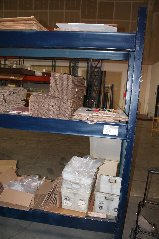 lot 242 image: Contents of (3) Shelves Including ULIne Boxes Miscellaneous Sizes Including 4 x 4 x 30 Does Not Include Shelving Unit.
