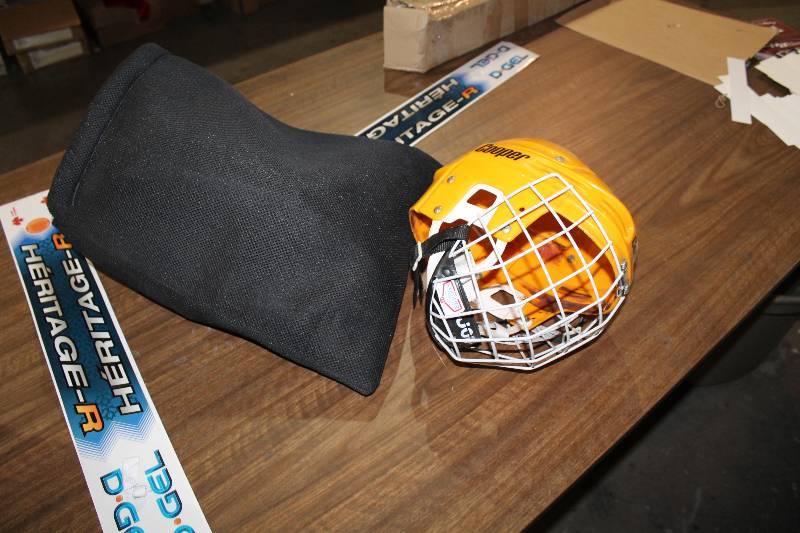 lot 1033 image: Lot of (2) including Cooper Hockey Helmet, Yellow Black Bag wGloves, Face Mask, And More.
