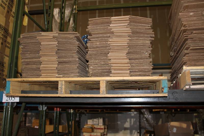 lot 205 image: Pallet Lot of (app. 100) Cardboard Puck Boxes.