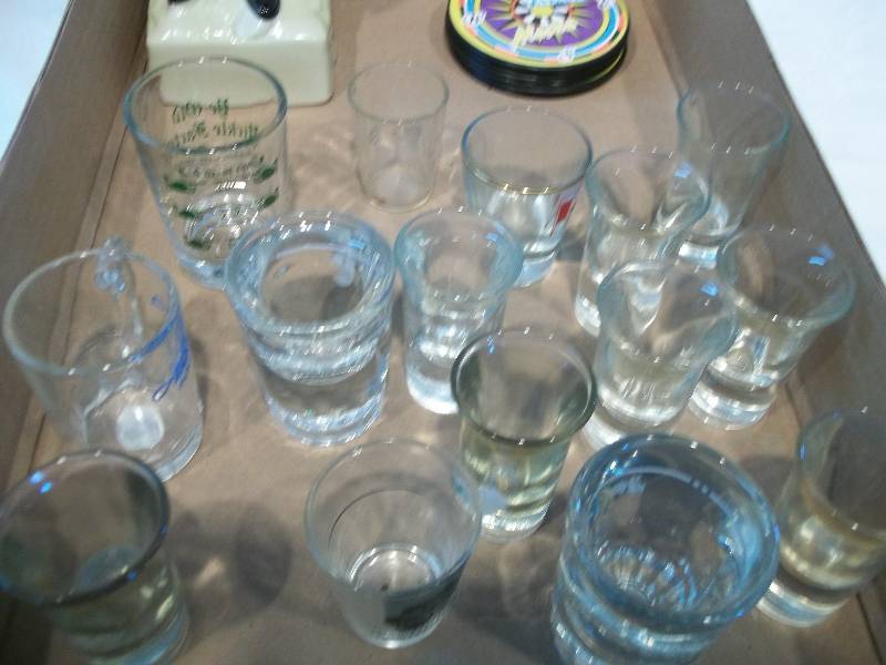 Barton Distilling Co. Bottle & Assorted Shot Glasses and Coasters.
