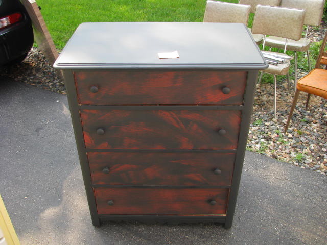 Black 4 drawer dresser with black and red drawers