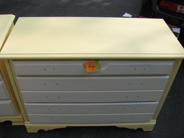 yellow three drawer dresser with white drawers