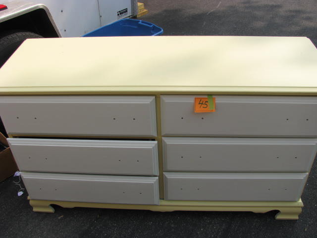 yellow six drawer dresser with white drawers