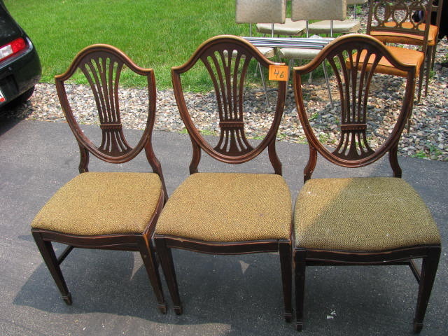 three dining room chairs ready to be refinished