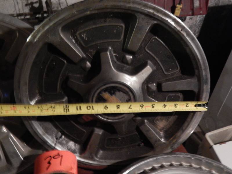 9 Vintage Chevy Hubcaps