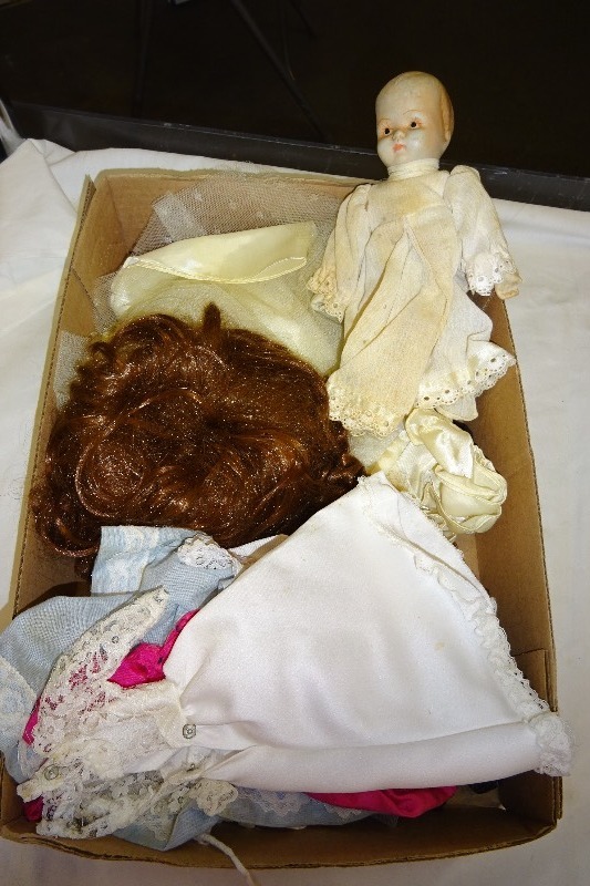 lot 93 image: Ceramic doll and clothes