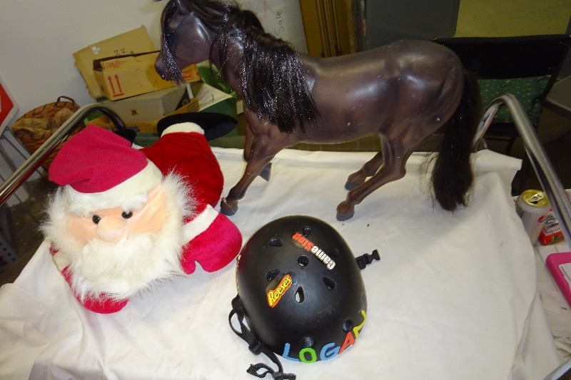 lot 134 image: Horse, helmet, stuffed santa