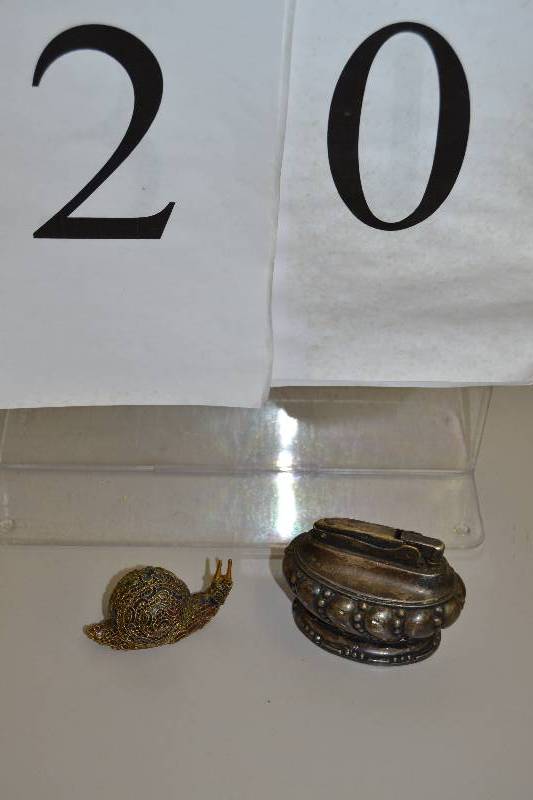 lot 20 image: Lighter & snail