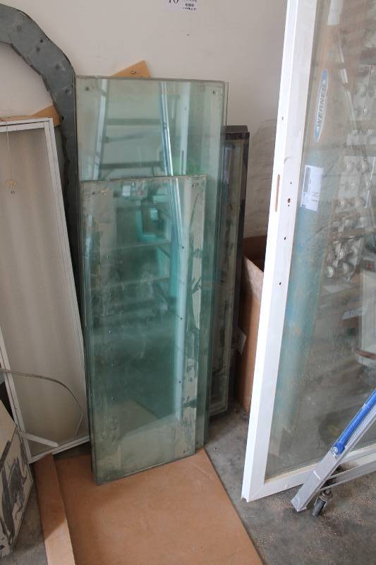 lot 16 image: Lot of Glass & Windows Including Pella Windows And More Dimensions 18.25 x 34.5 x (3) 16 x 43.25 (2) 19 x 34.5 (4) 22.5 x 48 (1).