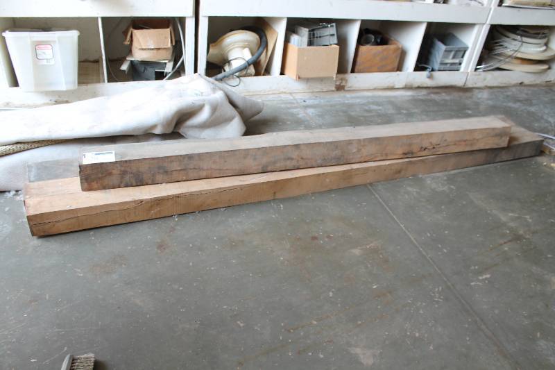 lot 28 image: Lot of (4) Wooden Beams 6  x  6 x 44 (1) 5 x 5 x 126 (3).
