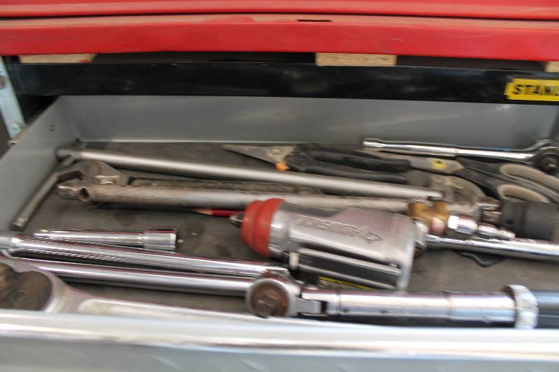 lot 49 image: Contents of Bottom Shelves (2) Including Ratchet Bars Hammer Air Tool And More.