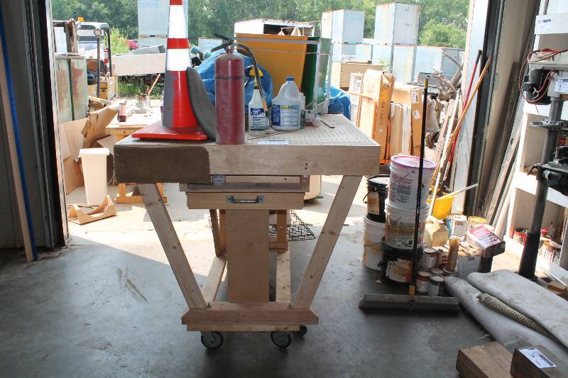 lot 52 image: Custom Wooden Work Bench wWheels & Work Top Includes Contents Caution Cone Metal Grates And More 48 x 47.5 x 45.