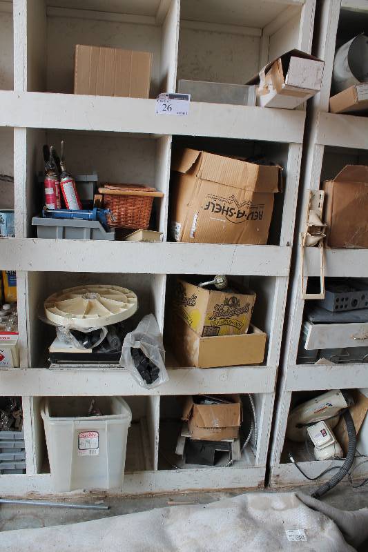 lot 26 image: Contents of Shelves (8) Including Caulking Gun PVC Adapters Fan Grate And More.