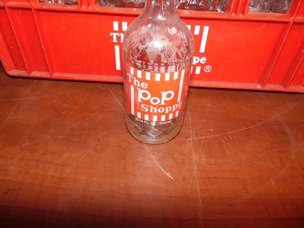 lot 60 image: The Pop Shoppe Glass Bottles with Plastic Crate