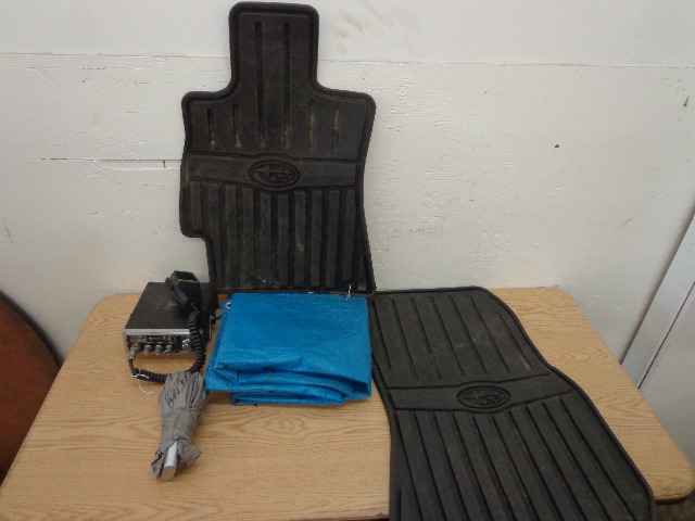 CB radio, vehicle floor mats, umbrella, tarp