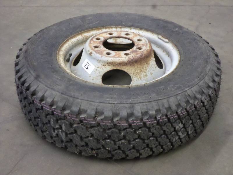lot 13 image: (1) 8-Lug Steel Rim With New Goodye...