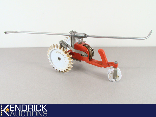 lot 46 image: Vintage Thompson Cast Iron Tractor Sprinkler