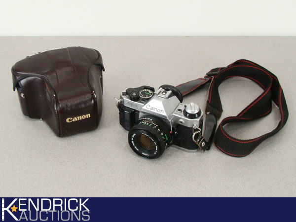 lot 50 image: Vintage Cannon AE-1 35mm Camera with Carrying Case