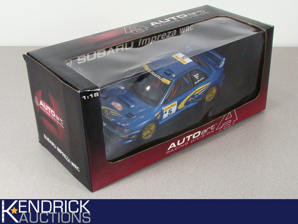 lot 93 image: Mint in Box 118 Scale Autoart Subaru Impreza WRC Die Cast Car