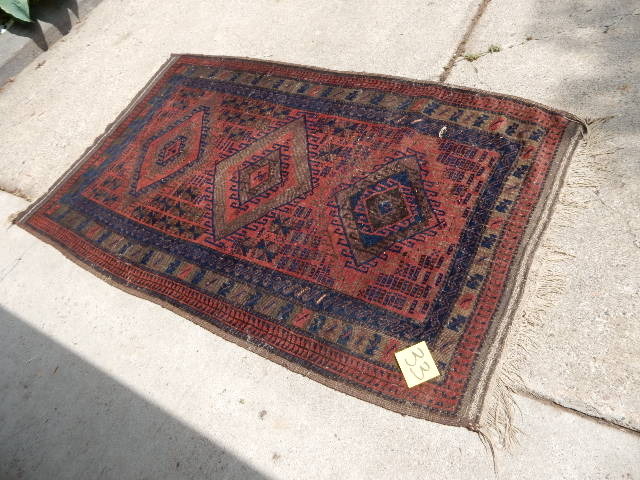 lot 33 image: We think a Persian Rug.  4ft x 6 ft