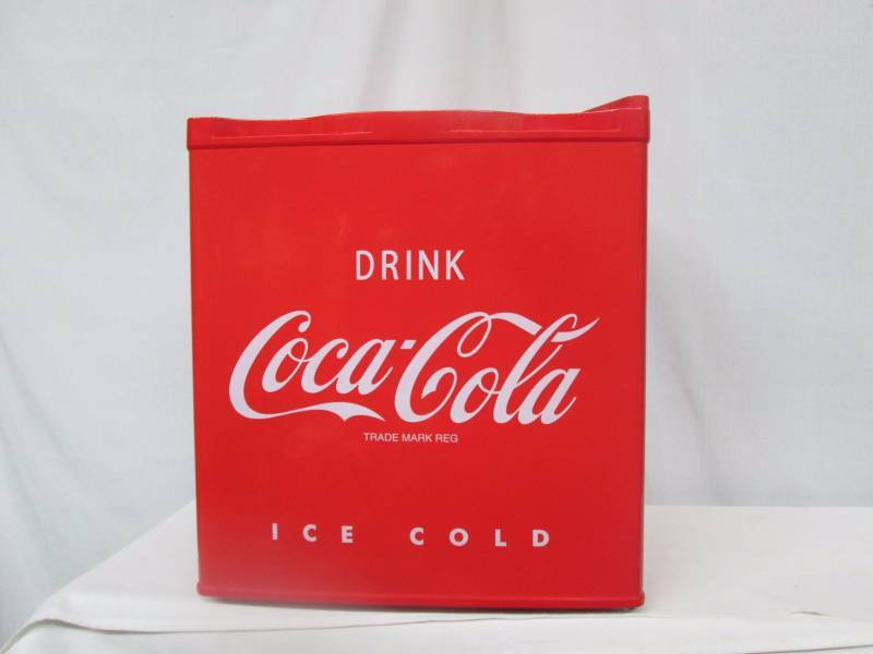 lot 15 image: Nostalgia Electrics Coca Cola Compact Refrigerator