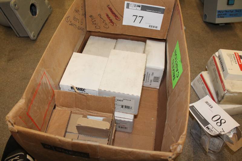 lot 77 image: Box Lot Including Honeywell 2 Stage Thermostats Bramec Thermostat Guard-Elite Series Clear Plastic And More.