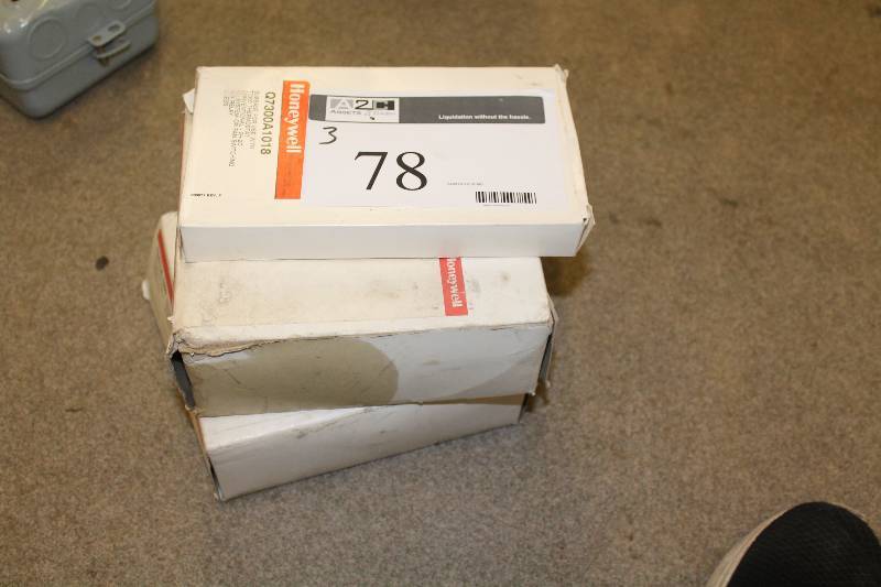 lot 78 image: Box Lot of (3) Including Honeywell Subbase For Use WT73000 Thermostat Conventional Versaguard Universal Thermostat Guards And More.