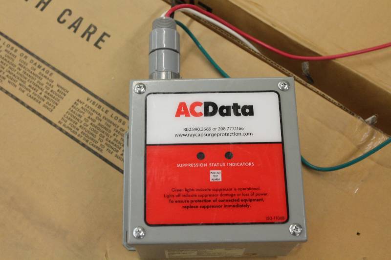 lot 35 image: AC Data Surge Supression Surge Protector wWires 8 x 5 x 10.