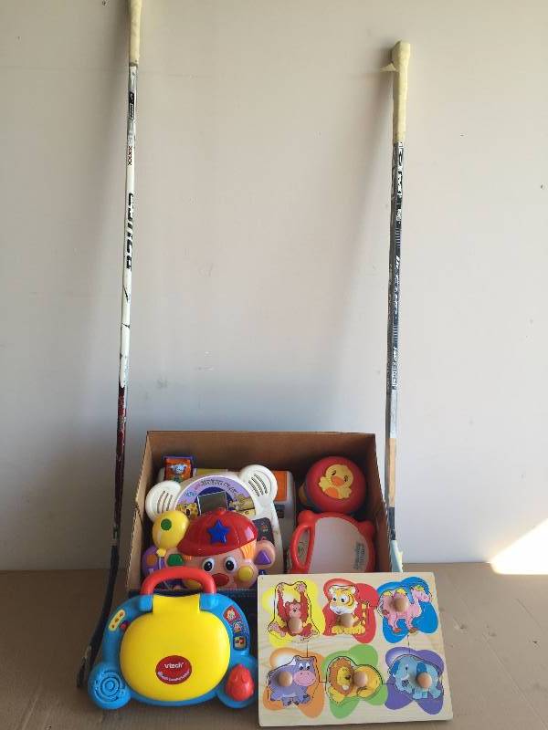 lot 18 image: CHILDRENS TOYS AND HOCKEY STICKS
