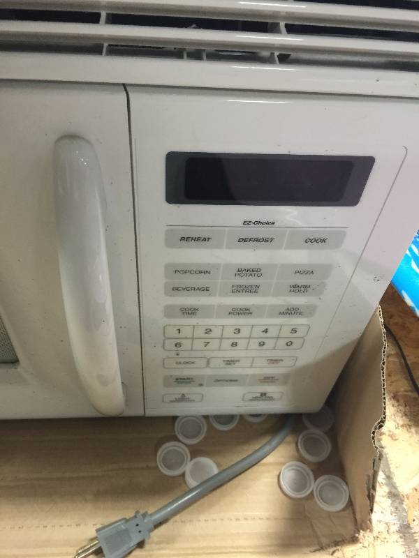 lot 21 image: Whirlpool Over The Range Microwave With Vent